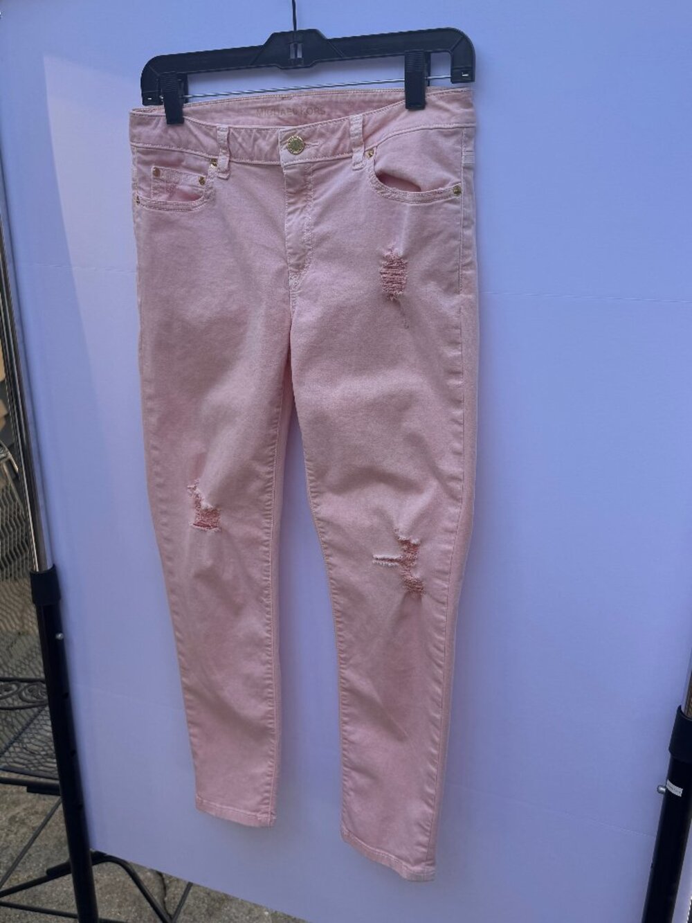 Pink distressed skinny jeans by Michael Kors